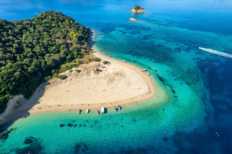 Aerial view of Marathonisi Island near Zakynthos island in Greece. Marathon island at sunrise in Zante, Ionian sea. Idyllic beach with turquoise sea water. Aerial view of Marathonisi Island near Zakynthos island in Greece. Marathon island at sunrise in Zante, Ionian sea. Idyllic beach with turquoise sea water