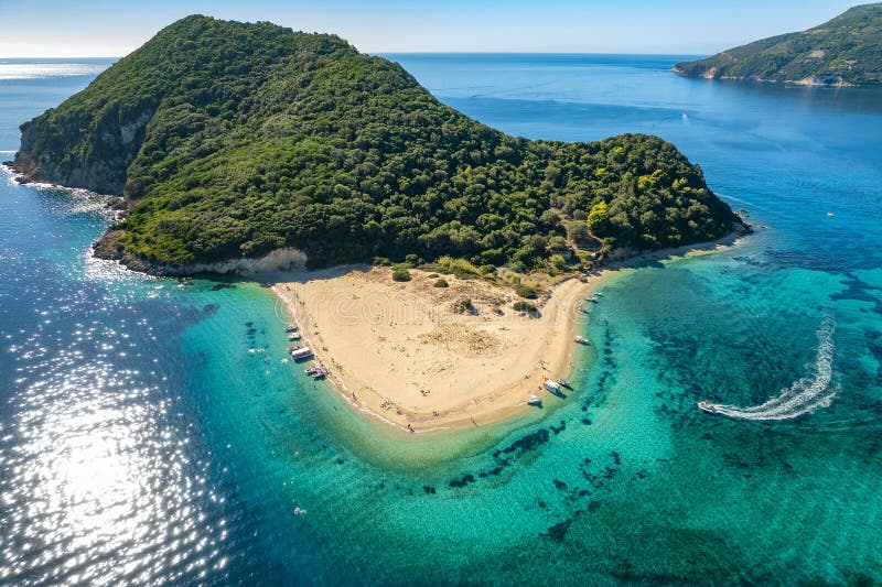 Aerial view of Marathonisi Island near Zakynthos island in Greece. Marathon island at sunny day in Zante, Ionian sea. Idyllic beach with turquoise sea water. Aerial view of Marathonisi Island near Zakynthos island in Greece. Marathon island at sunny day in Zante, Ionian sea. Idyllic beach with turquoise sea water