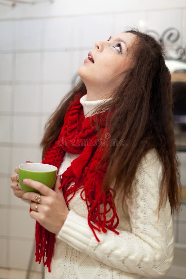 Sick woman gargling throat in her bathroom. Sick woman gargling throat in her bathroom