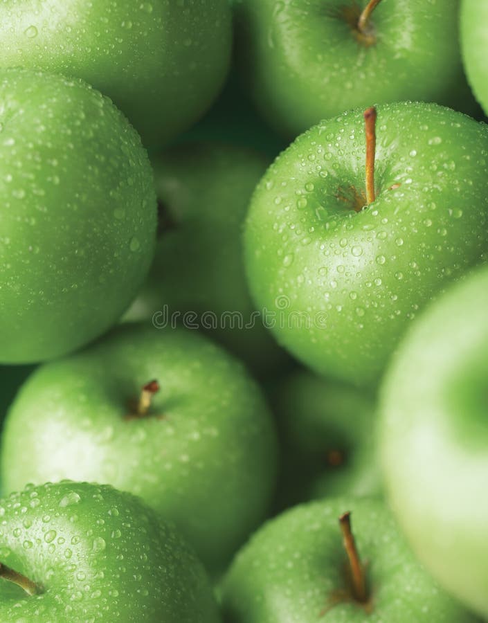 Green apple with water drop, swallow depth of field. Green apple with water drop, swallow depth of field