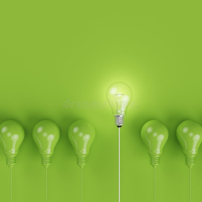 Green pantone light bulbs with glowing one different idea on pastel green background. minimal concept. top view. Green pantone light bulbs with glowing one different idea on pastel green background. minimal concept. top view.