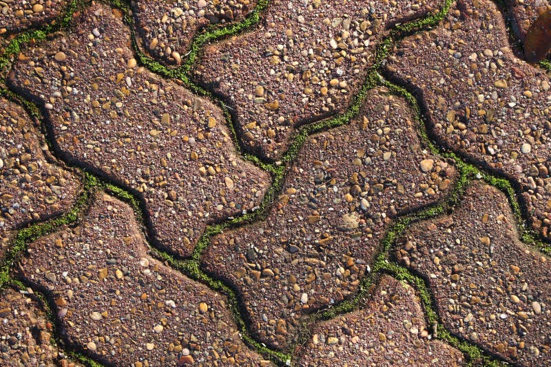 Zig-zag bricks with moss in between royalty free stock images