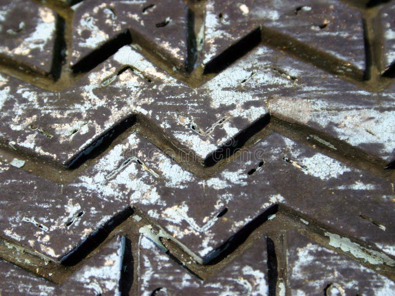 Zig zak old painted tire pattern close-up. Zig zak old painted tire pattern close-up.