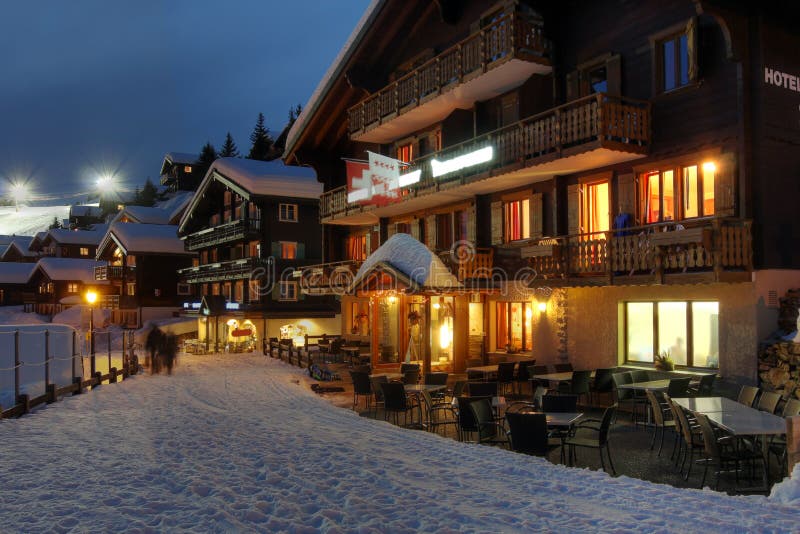 Hotel and winter resort scene in Bettmeralp, Switzerland at night. Hotel and winter resort scene in Bettmeralp, Switzerland at night.