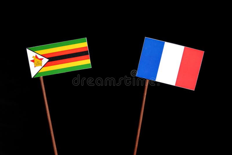 Zimbabwe flaga z francuz flaga na czerni zdjęcie royalty free