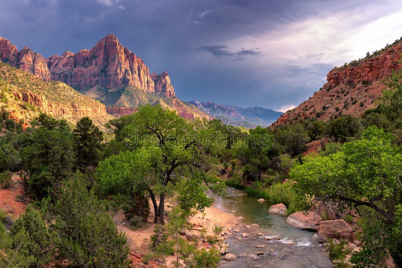 Sunset at Watchman mountain in Zion National park and the virgin river. Zion National Park is located in the Southwestern United States, near Springdale, Utah. Sunset at Watchman mountain in Zion National park and the virgin river. Zion National Park is located in the Southwestern United States, near Springdale, Utah.