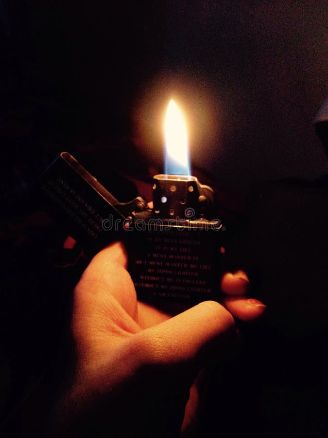 zippo-flame-lighter-fire-dark-hand-56231777.jpg