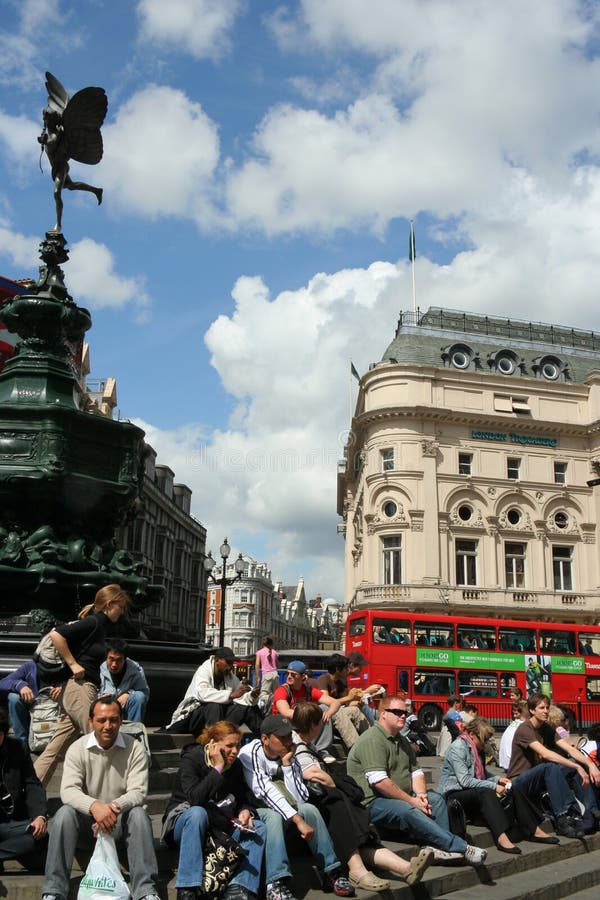 Tourists and shoppers rest beneath the statue known as Eros, at one of London's best known intersections. Tourists and shoppers rest beneath the statue known as Eros, at one of London's best known intersections.