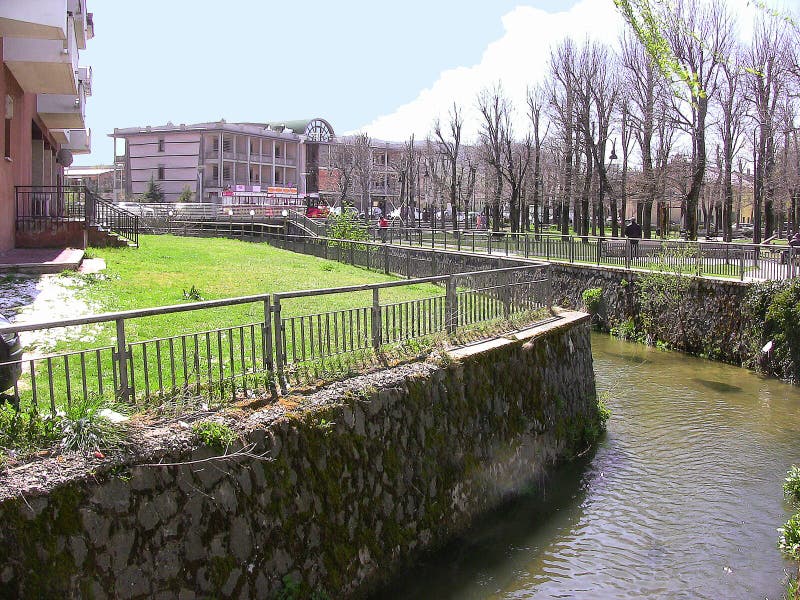 Castel di Sangro, Abruzzo, Italy - April 9, 2012: Zittola river and urban park during the Easter holiday, in the background one of the new buildings built in Porta Napoli street. No people