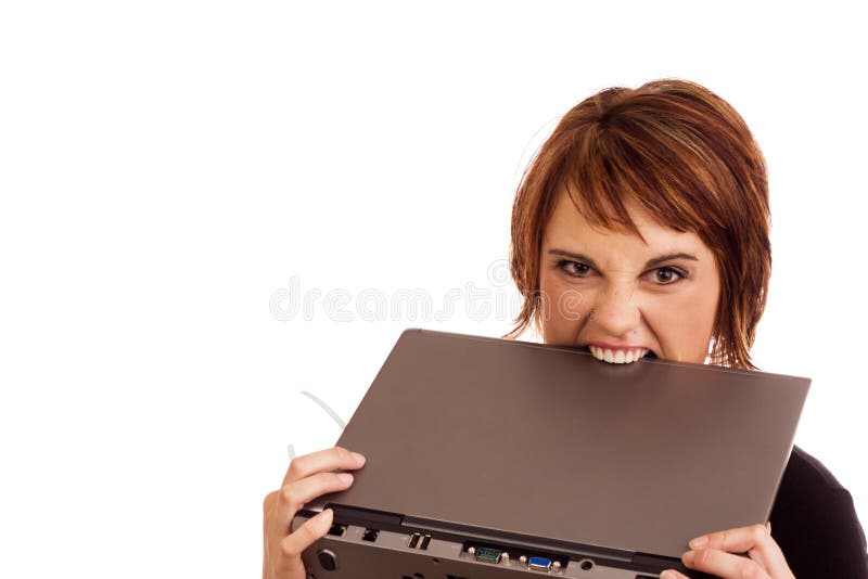 Frustrated Caucasian business woman holding her glasses and biting laptop in anger. Frustrated Caucasian business woman holding her glasses and biting laptop in anger