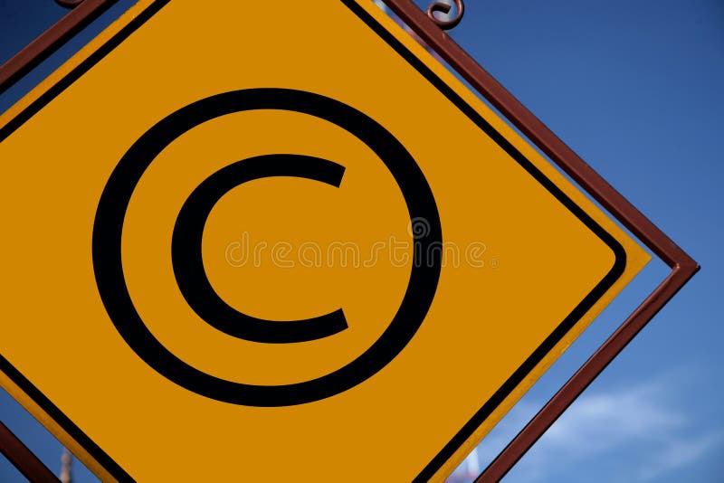 Copyright symbol on a yellow rhomboid road sign with an ornamental frame of bronze color. Copyright symbol on a yellow rhomboid road sign with an ornamental frame of bronze color.