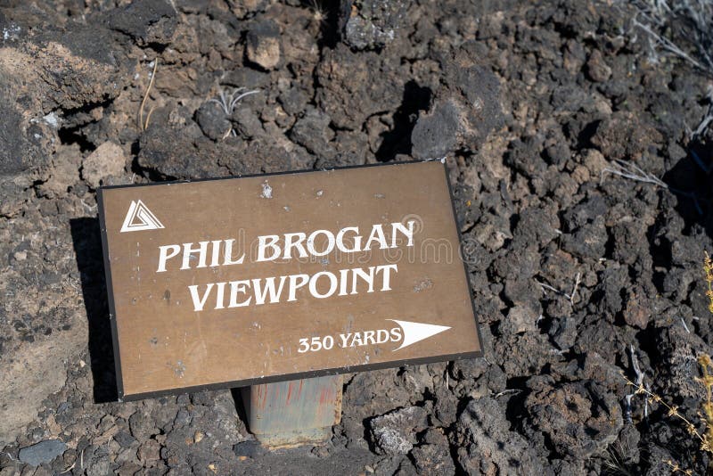 Bend, Oregon - August 3, 2020: Sign for the Phil Brogan Viewpoint at Lava Lands Newberry Volcano National Monument. Bend, Oregon - August 3, 2020: Sign for the Phil Brogan Viewpoint at Lava Lands Newberry Volcano National Monument