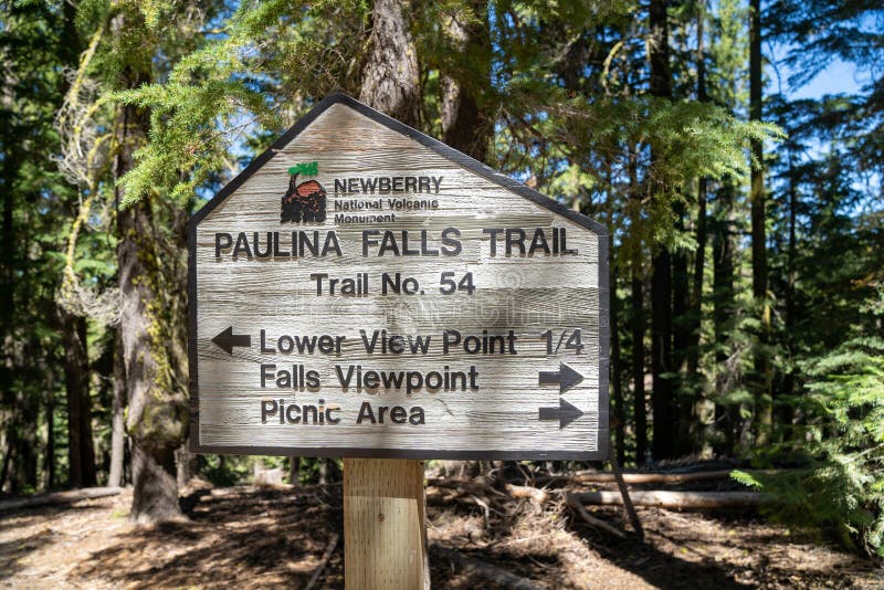 Bend, Oregon - August 3, 2020: Sign for the Paulina Falls Trail, a popular waterfall in Newberry Volcano National Monument. Bend, Oregon - August 3, 2020: Sign for the Paulina Falls Trail, a popular waterfall in Newberry Volcano National Monument