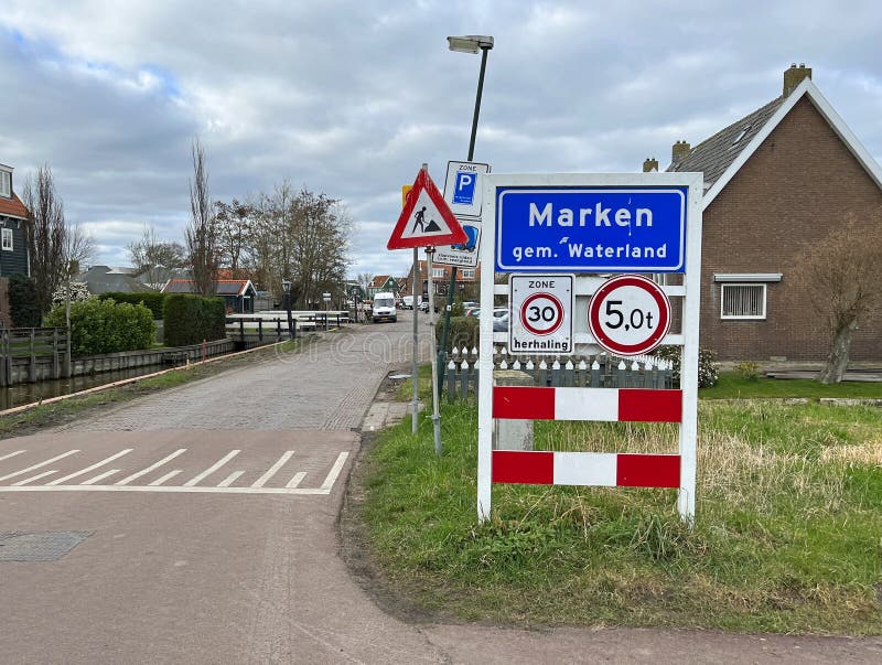 Marken,the Netherlands - March 3,2023: City entrance sign of Dutch town of Marken. Marken,the Netherlands - March 3,2023: City entrance sign of Dutch town of Marken.