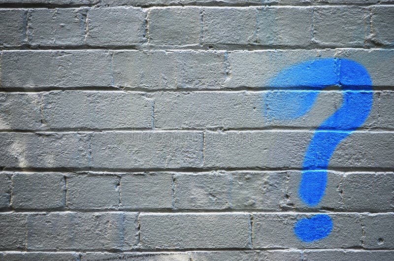 Blue spray painted question mark on brick background with copy space. Blue spray painted question mark on brick background with copy space