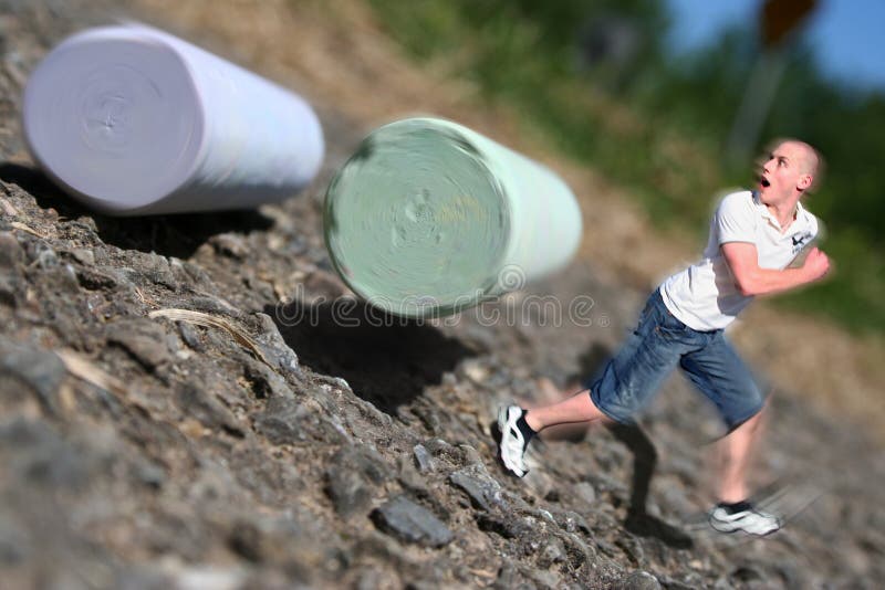 Run!!!! When your only 1 inch tall, everything is out to get you! Even chalk set rolling down the street by some careless kids. A surreal scene of a little person running away from normal sized chalk. Run!!!! When your only 1 inch tall, everything is out to get you! Even chalk set rolling down the street by some careless kids. A surreal scene of a little person running away from normal sized chalk.