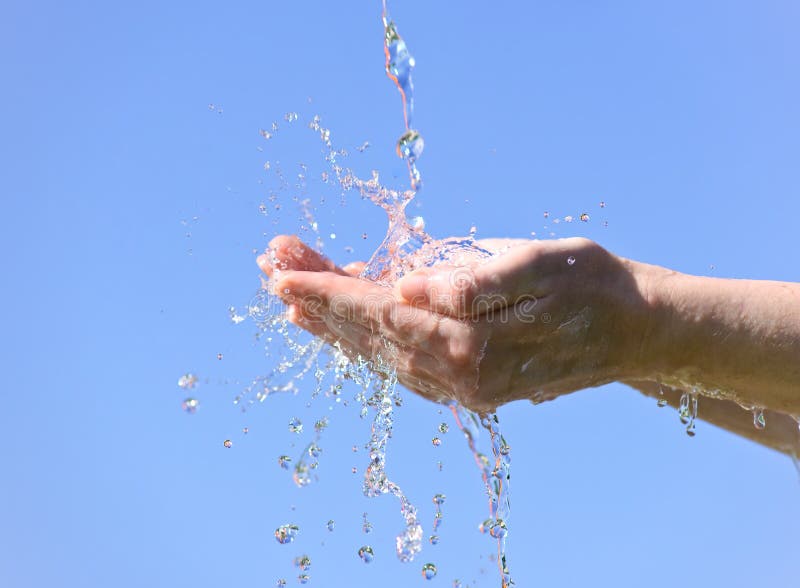 Human hands and splashing water. Human hands and splashing water