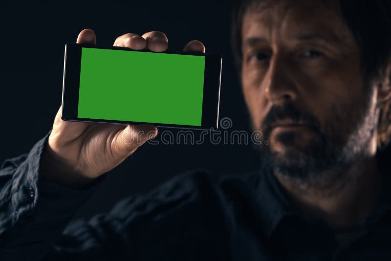 Zombaria de Smartphone acima na m?o masculina foto de stock Zombaria de Smartphone acima na m?o masculina foto de stock