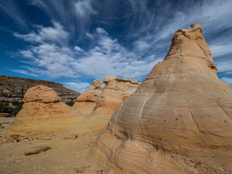 Colorfully Banded Cretateous Sandstone Under A Cloudy Sky, Ojito Wilderness, Sandoval County, New Mexico. Colorfully Banded Cretateous Sandstone Under A Cloudy Sky, Ojito Wilderness, Sandoval County, New Mexico