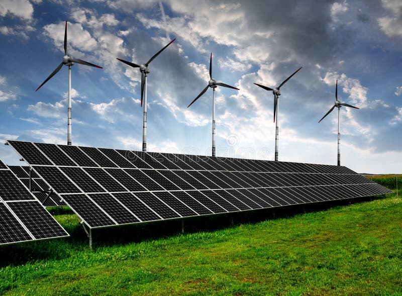 Solar energy panels and wind turbines in the sunset. Solar energy panels and wind turbines in the sunset