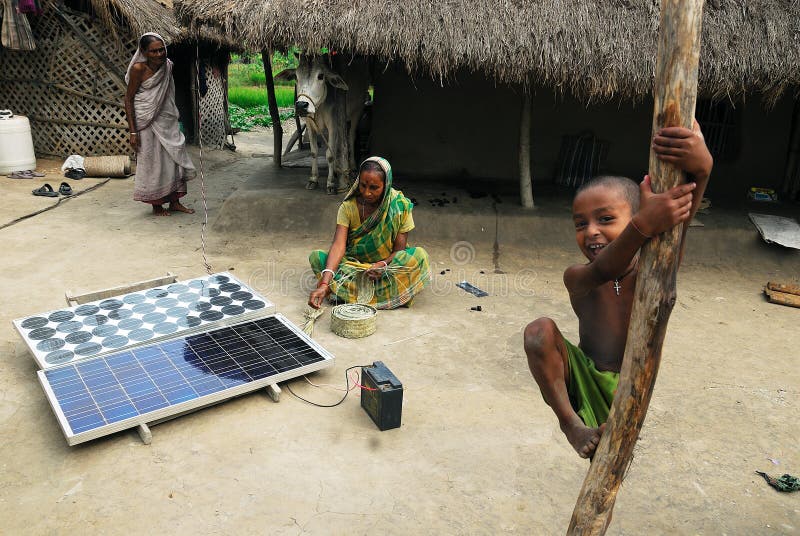 A solar plate being charged in front of a house. A solar plate being charged in front of a house