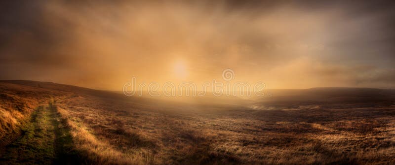 As the sun approaches days end over Axe Edge a thin veil of low cloud begins to build in the south west. Suddenly the sun just seems to explode as the building moisture in the air scatters the suns low angle rays across the moorland turning everything orange with its fiery glow. As the sun approaches days end over Axe Edge a thin veil of low cloud begins to build in the south west. Suddenly the sun just seems to explode as the building moisture in the air scatters the suns low angle rays across the moorland turning everything orange with its fiery glow.