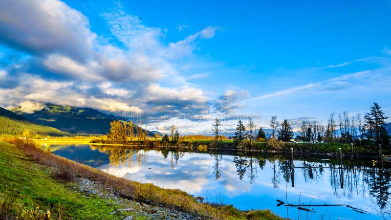 Sunset over Nicomen Slough along the Lougheed Highway between the towns of Deroche and Mission, British Columbia, Canada. Sunset over Nicomen Slough along the Lougheed Highway between the towns of Deroche and Mission, British Columbia, Canada