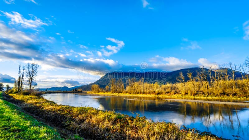 Sunset over Nicomen Slough along the Lougheed Highway between the towns of Deroche and Mission, British Columbia, Canada. Sunset over Nicomen Slough along the Lougheed Highway between the towns of Deroche and Mission, British Columbia, Canada