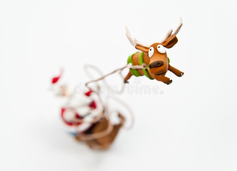 Zoom in reindeer with Santa Claus riding on sleigh