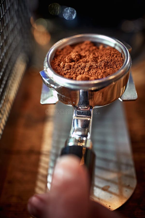 Zoomin View on a Measure of Ground Coffee for an Espresso. Coffee