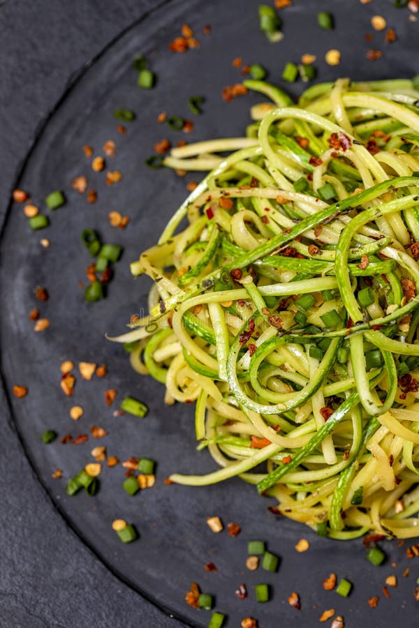 Zucchini Spaghetti with Dehydrated Pepperoni Pepper Stock Photo Image