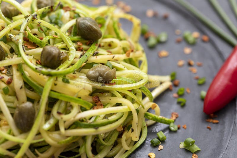 Zucchini Spaghetti with Dehydrated Pepperoni Pepper and Capers Stock