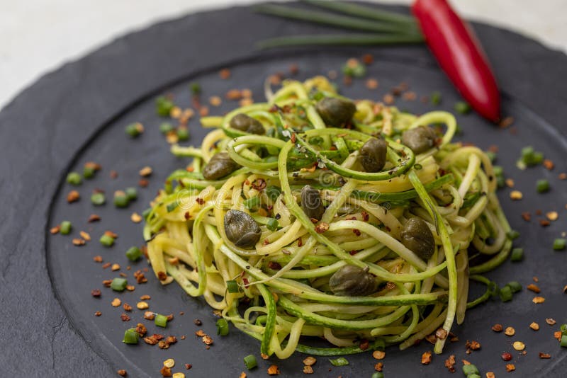 Zucchini Spaghetti with Dehydrated Pepperoni Pepper and Capers Stock