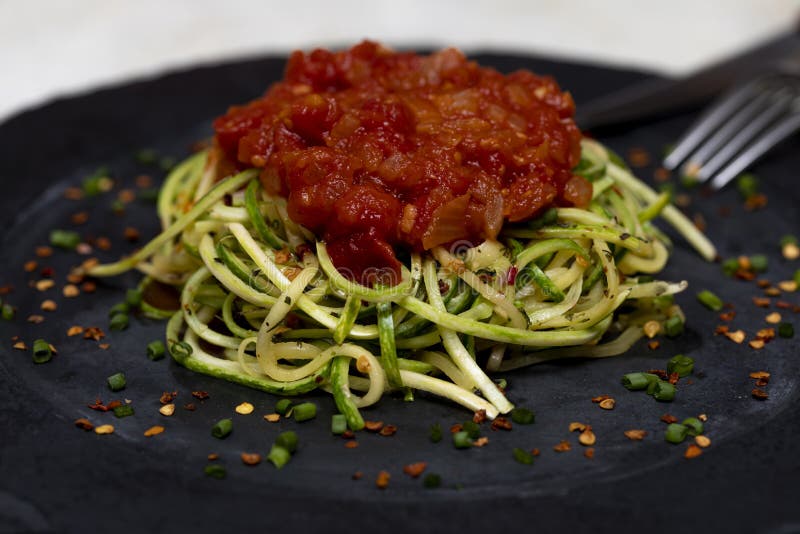 Zucchini Spaghetti with Dehydrated Pepperoni Pepper and Red Sauce Stock