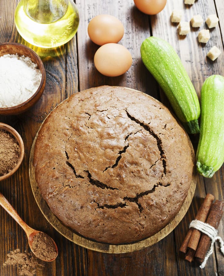 Zucchini cake with cocoa powder on the table. Zucchini cake with cocoa powder on the table