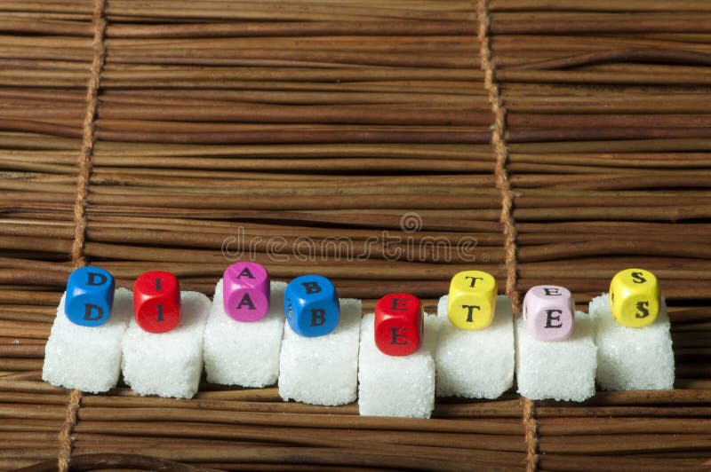 Zuckerklumpen und Wortdiabetes stockfotografie Zuckerklumpen und Wortdiabetes stockfotografie