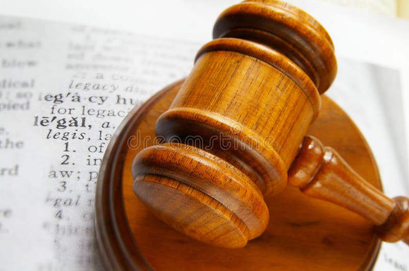 Closeup of a court gavel and legal definition. Closeup of a court gavel and legal definition