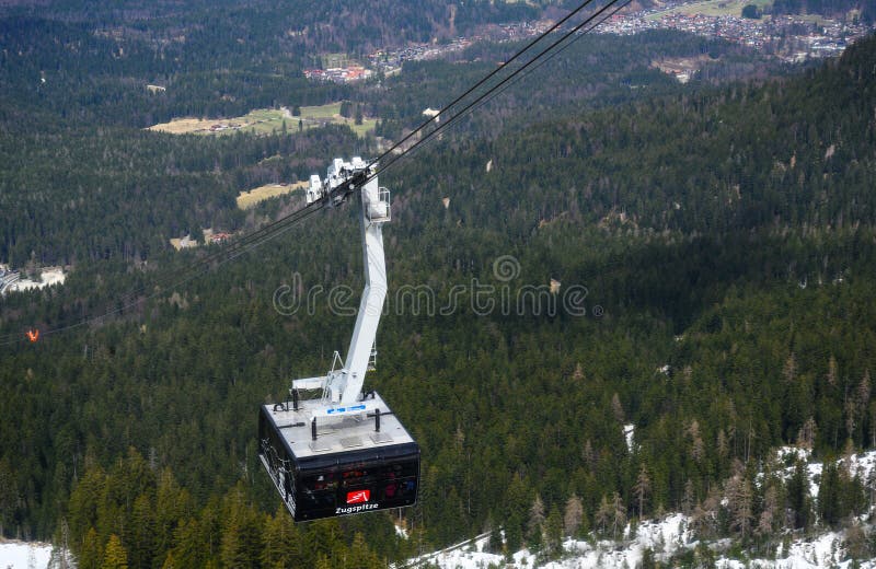 ZUGSPITZE, GERMANY, April 3, 2019: ropeway gondola or cable car with a lot of tourists is driving to the Zugspitze, the highest