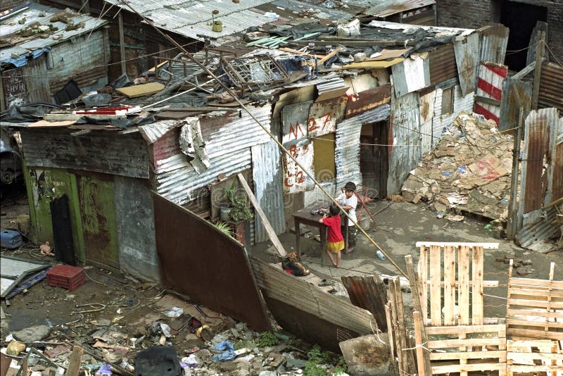 ARGENTINA: daily life in the slum Villa General Belgrano, Ciudad Oculta or Villa 15 in the center of the city, capital Buenos Aires. Most people live far below the poverty line and the Argentineans in this slum live under inhuman living conditions. These people live in a shack of corrugated sheets. The children, boys play on a table between the waste. Violation of human rights. ARGENTINA: daily life in the slum Villa General Belgrano, Ciudad Oculta or Villa 15 in the center of the city, capital Buenos Aires. Most people live far below the poverty line and the Argentineans in this slum live under inhuman living conditions. These people live in a shack of corrugated sheets. The children, boys play on a table between the waste. Violation of human rights.