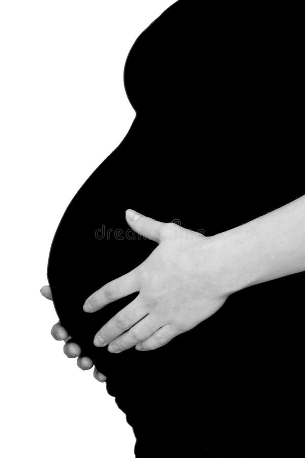 Pregnant women touching her belly tenderly. Pregnant women touching her belly tenderly