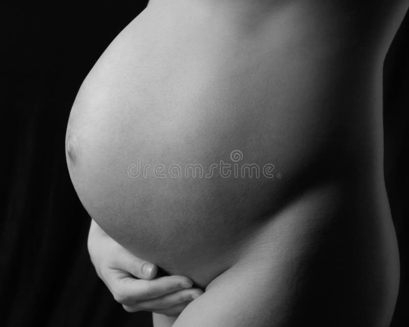 Pregnant mother to be holding her belly. Pregnant mother to be holding her belly.