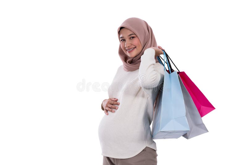 Zwangere de vrouw toont veel het winkelen zakken stock foto Zwangere de vrouw toont veel het winkelen zakken stock foto