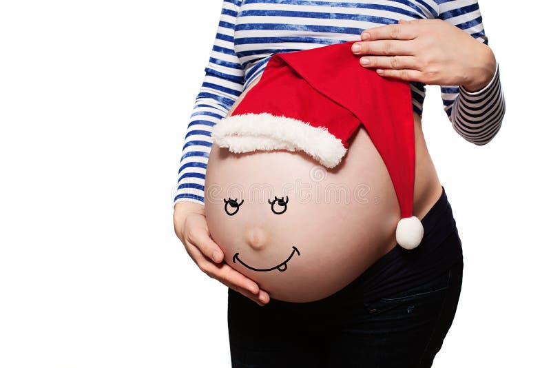 Zwangere vrouw Babybuil met Santa Hat stock fotografie Zwangere vrouw Babybuil met Santa Hat stock fotografie