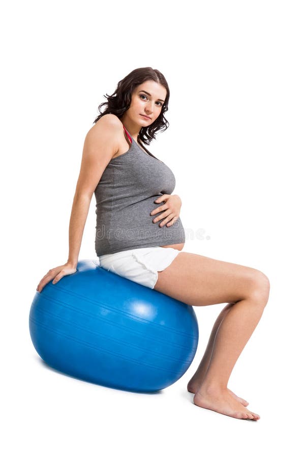 Zwangere vrouw die pilates oefeningen doen stock foto Zwangere vrouw die pilates oefeningen doen stock foto