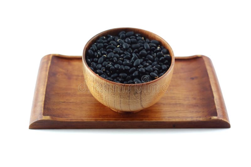 Zwarte bonen in een houten kom royalty-vrije stock foto's