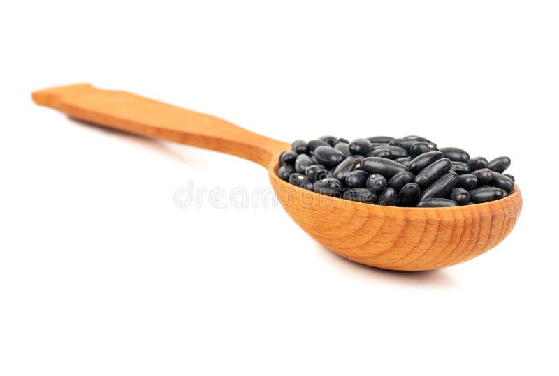 Zwarte bonen in lepel royalty-vrije stock afbeelding