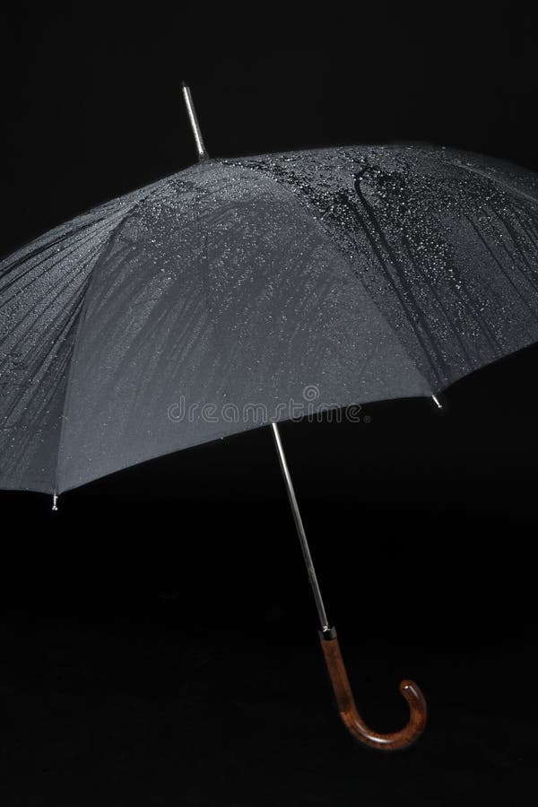 Black umbrella in the rain. Black umbrella in the rain