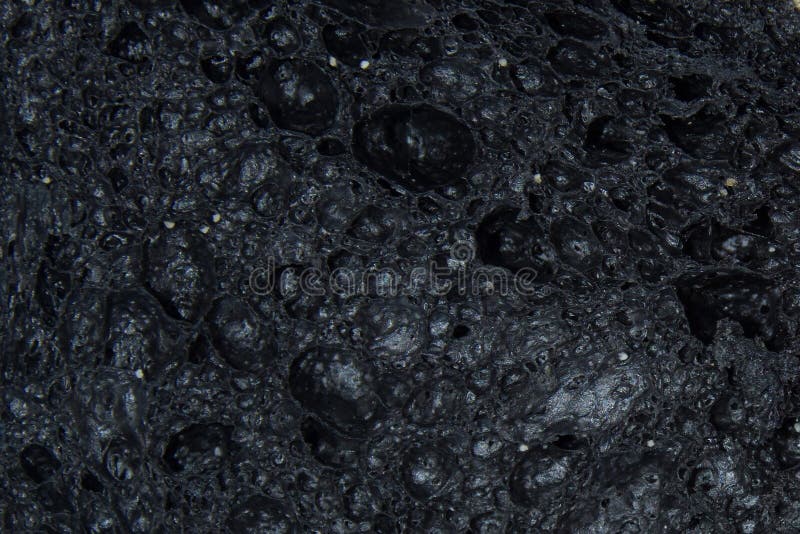 Zwarte Poreuze textuur of achtergrond Zachte selectieve focus stock foto's