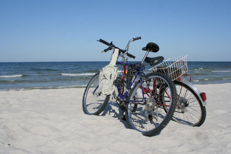 Two bicycles on a beach. Two bicycles on a beach