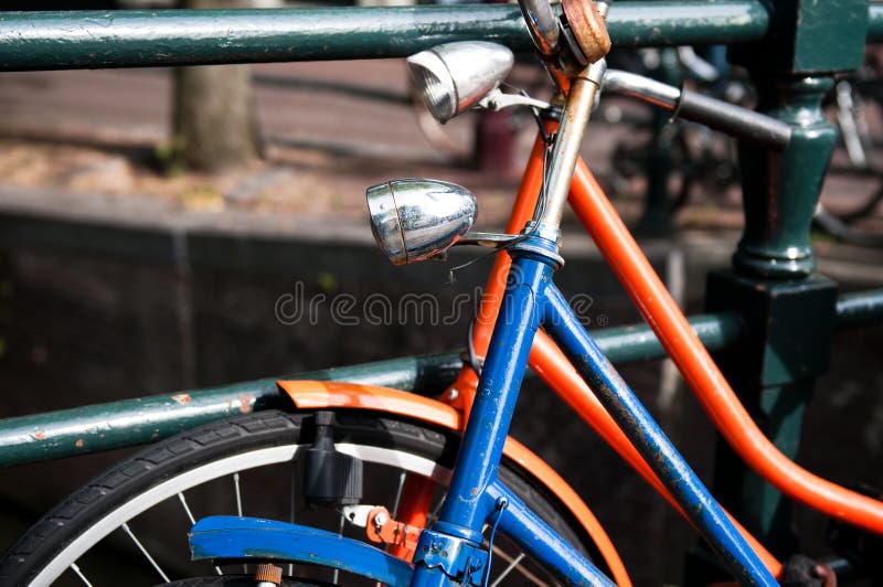 Pair of bicycles rested against each other in Amsterdam, the Netherlands. Pair of bicycles rested against each other in Amsterdam, the Netherlands